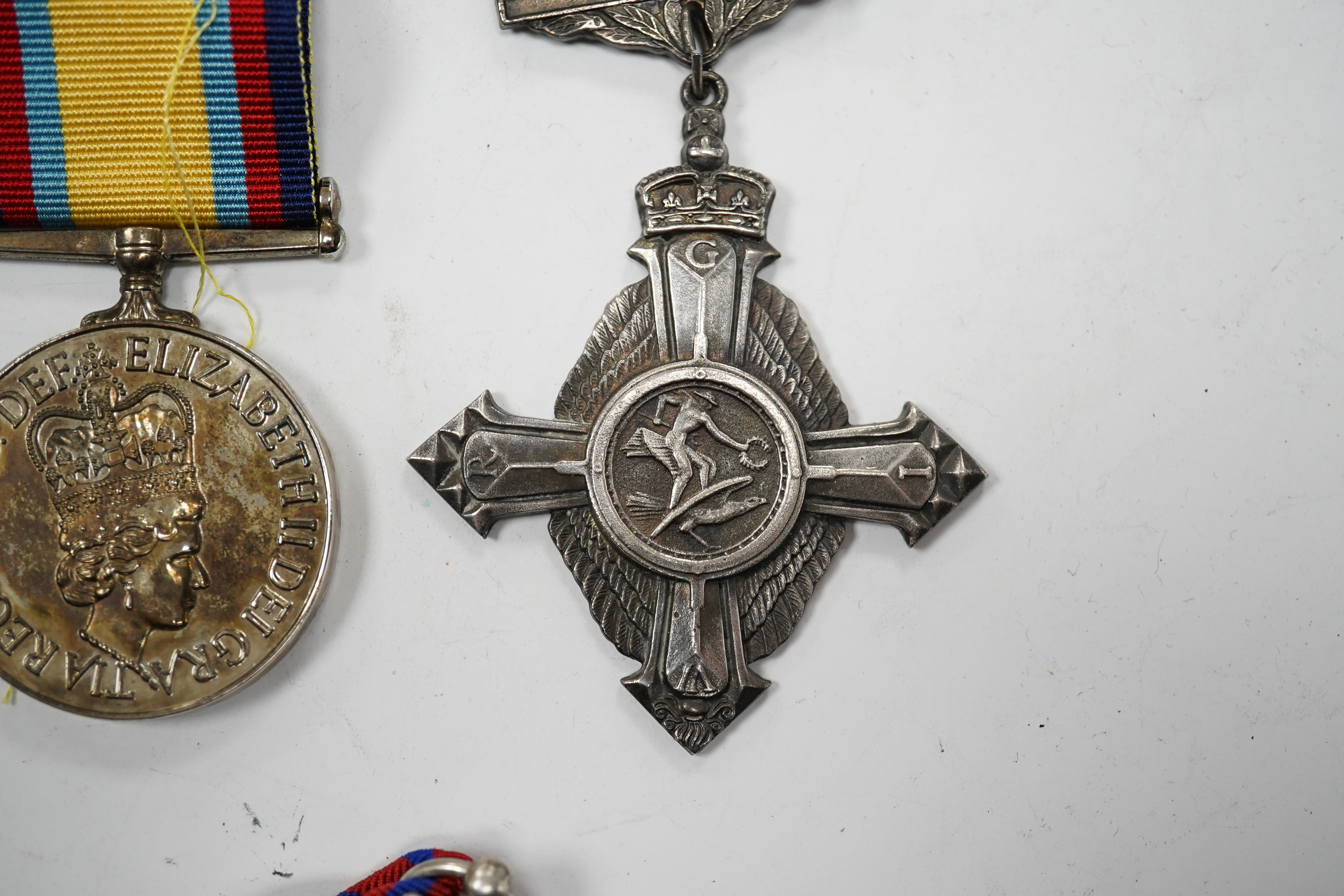 Twelve ERII and George VI medals, some medals arranged into two medals groups (containing unnamed medals and medals awarded to different recipients within the same group), including